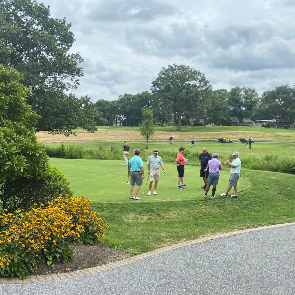 Members of the NDIA DVC and community golf during the Annual Golf Outing.