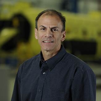 Charles Dabundo smiles